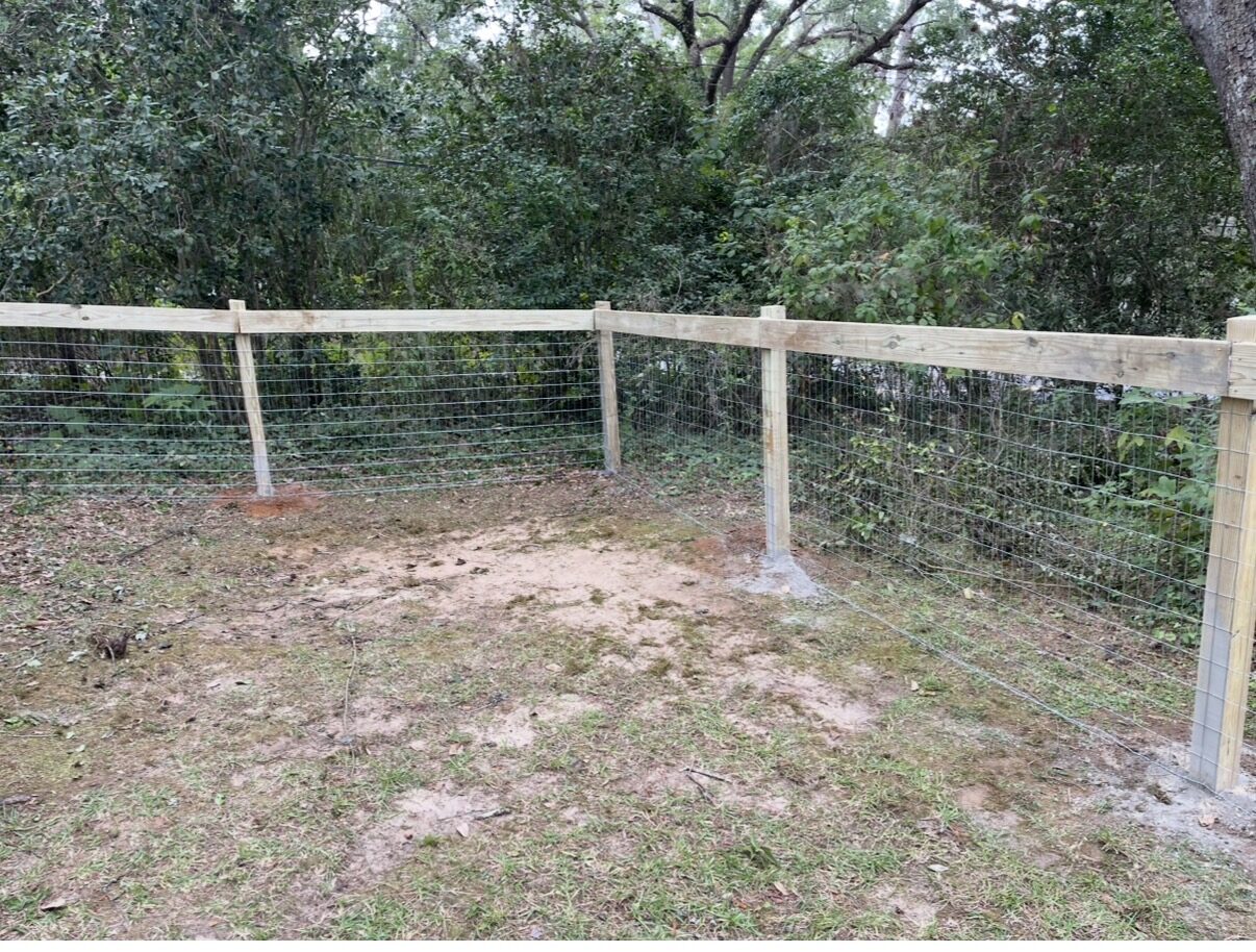Field fence with wood post and top rail